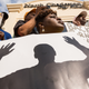 People participate in a rally to protest the death of Walter Scott, outside City Hall on April 8, 2015, in North Charleston, S.C.
Richard Ellis/Getty Images